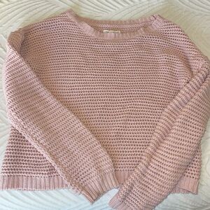 Light pink women’s sweater.